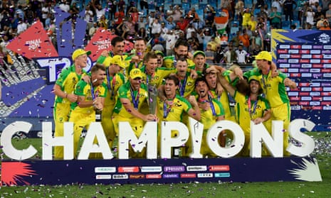 Australia celebrate with the trophy after beating New Zealand to win their first T20 world title