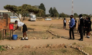 Students practice social distance in a queue for handwashing on 30 September 30, 2020 in Harare, Zimbabwe.