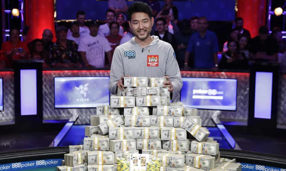 John Cynn poses for photographers after winning the World Series of Poker main event