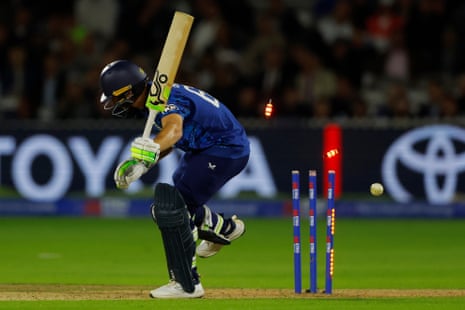 England's Jos Buttler is bowled out by South Africa's Lungi Ngidi.