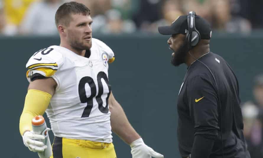 Pittsburgh Steelers head coach Mike Tomlin talks to linebacker TJ Watt during a game against the Green Bay Packers in October.