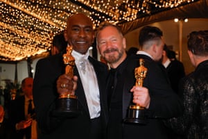 Paul Tazewell, winner of the Oscar for Best Costume Design for Wicked , and Lee Sandales, winner of the Oscar for Best Production Design for Wicked at the Governors Ball
