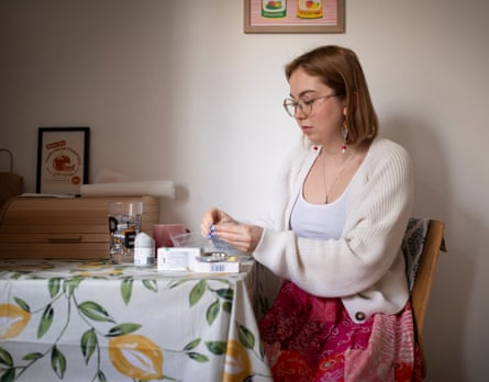 Maddie Cowey taking medication at home