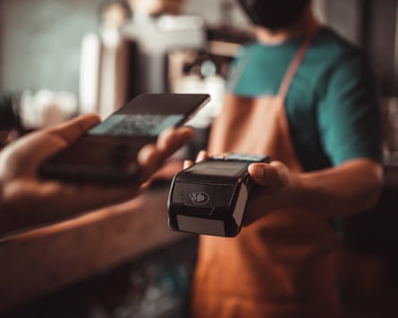 Person holding eftpos machine