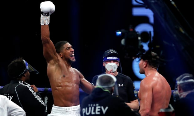 Anthony Joshua celebrates after being officially declared winner of his defence against Kubrat Pulev.