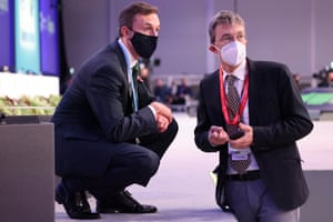 The UK chief negotiator, Archie Young, and the head of the international affairs division at the Swiss federal office for the environment, Franz Perrez, watch the action