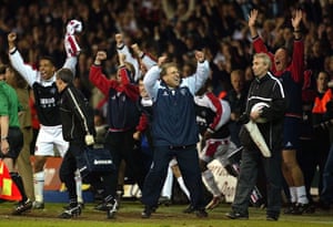 Neil Warnock and the Sheffield United bench celebrate at the final whistle.