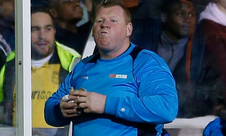 Wayne Shaw faces an FA investigation after eating a pie on the touchline during Sutton’s defeat to Arsenal.
