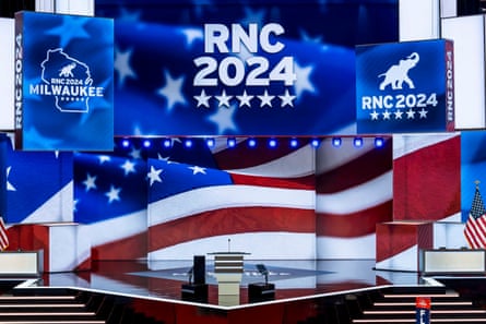 stage set with screens showing US flags and the words “RNC 2024” and “Milwaukee”