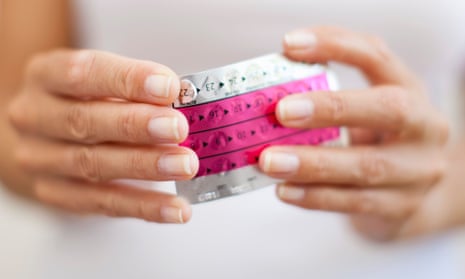 Woman's hands holding a packed of birth control pills.
