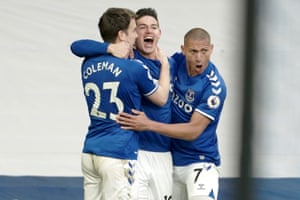 James Rodriguez of Everton (C) celebrates with teammates Seamus Coleman and Richarlison after scoring.