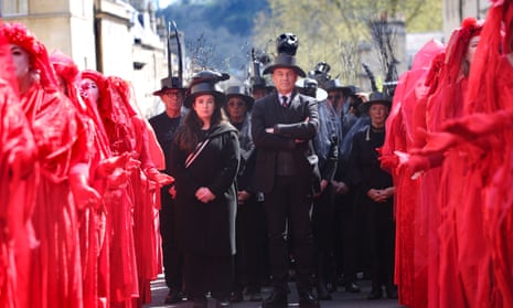Nature campaigners Megan McCubbin and Chris Packham joined 400 Red Rebels in Bath in ‘funeral’  procession highlighting the loss of UK biodiversity