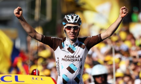 Romain Bardet crosses the finish line to win Stage Eightee.