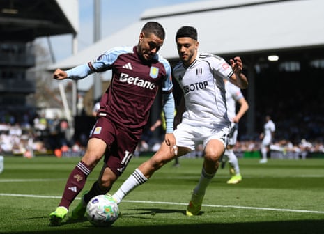 Emi Buendia (left) and Raul Jimenez go toe-to-toe in the early stages of Fulham’s match against Aston Villa at Craven Cottage.