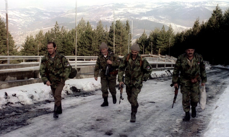 Bosnian Serb soldiers pass the Olympic bobsleigh track on Mount Trebević in February 1994, at the height of the conflict.