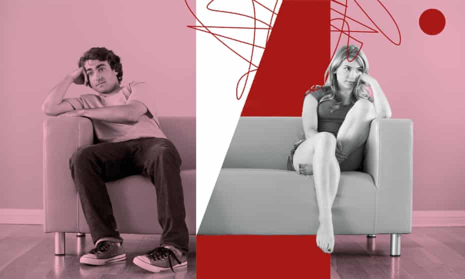 A man and a woman sit facing in opposite directions on a sofa, looking dejected.