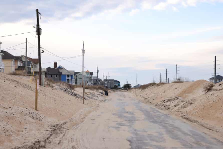 Driving North Carolina’s Highway 12Rodanthe, NC A residential road running parallel to Highway 12 in Rodanthe is covered in sand after a recent storm. Highway 12 runs the length of North Carolina’s Outer Banks, an area subject to damage from heavy storms and rising tides. (Travis Dove for The Guardian)