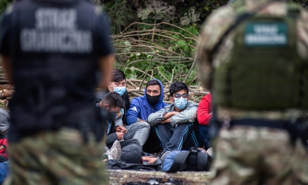 Border guards are seen guarding Afghan refugees at the Polish and Belarusian border, August 2021.