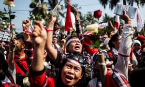 Ahok supporters protest outside the court in Jakarta.
