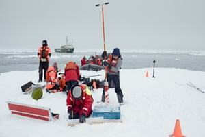 Dr Till Wagner (right) drills an ice floe as student Elizabeth Bailey cuts off a sea ice core in Fram strait