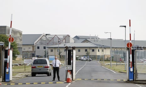 A security guard at gates to Yarl’s Wood immigration detention centre.