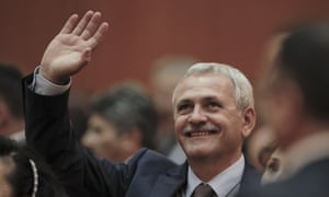Head of the PSD, Liviu Dragnea, waves to supporters after the vote