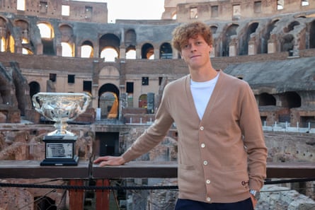 Australian Open winner Jannik Sinner poses with the Norman Brookes Challenge Cup at the Colosseum in Rome in January 2024.