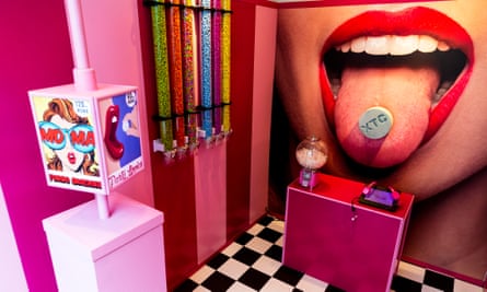 Inside XTC shop including image of a pill on a woman’s tongue.