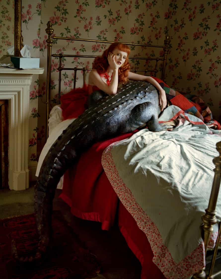 Karen Elson shot in bed with a crocodile shot for the December 2008 issue of British Vogue by Tim Walker