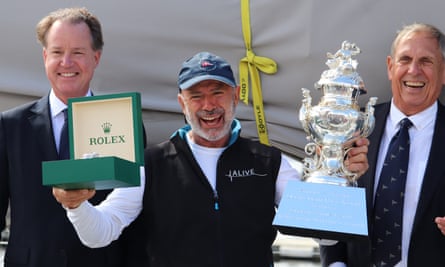 Alive skipper Duncan Hines holds the Tattersall Cup for overall winner of the Sydney to Hobart yacht race