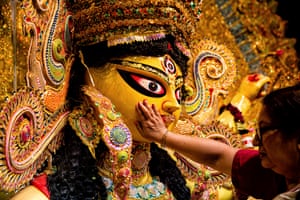 The goddess is offered food and sindoor (vermillion) as part of the preparation of her final journey from the pandal (temporary tent erected for Durga Puja) to the river.