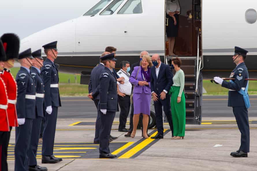 The president of the European Council, Charles Michel, and his partner, Amelie Derbaudrenghien (in green), meeting Georgina Butler, special representative of the foreign secretary (purple)