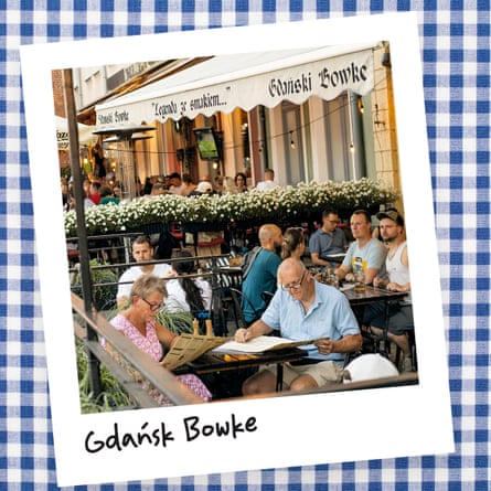 Exterior shot of diners outside Gdański Bowke restaurant in Gdańsk, Poland.