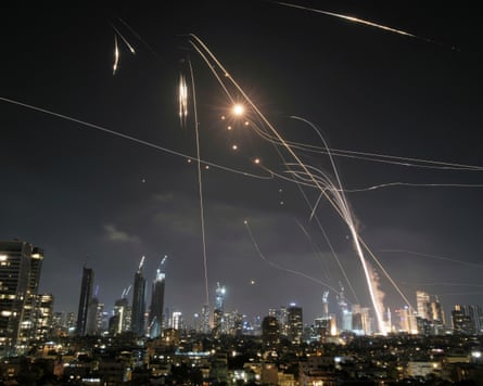 Streaks of light in the night sky over Tel Aviv