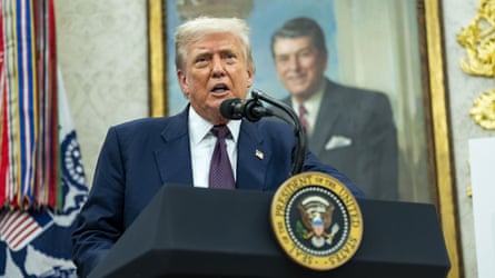Donald Trump speaking at a lectern
