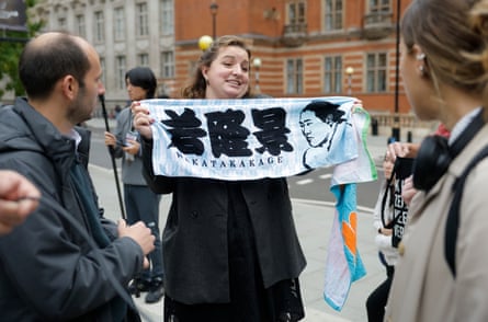 A fan holds up a banner in support of Wakatakakage before the event at the Royal Albert Hall.