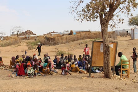 An outdoor classroom filled with children in a Chad refugee camp.