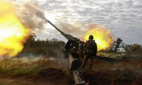 Ukrainian servicemen shoot from a captured Russian howitzer on a front line near  Kupyansk city in the Kharkiv  area, 6 October 2022.