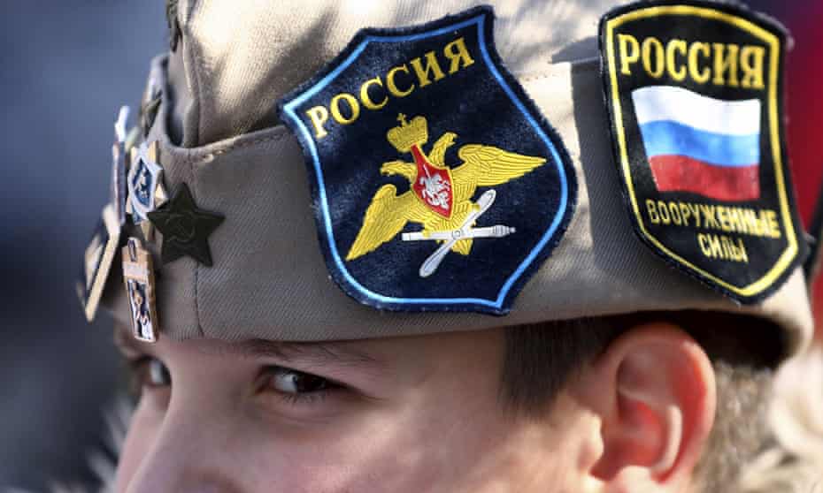 A boy wears Russian insignia on his hat as Bosnian Serb nationalists demonstrated in Banja Luka in support of Vladimir Putin's invasion of Ukraine.