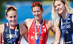 Nicola Spirig (centre) celebrates winning the gold medal in the triathlon ahead of Jessica Learmonth (left) and Cassandre Beaugrand.