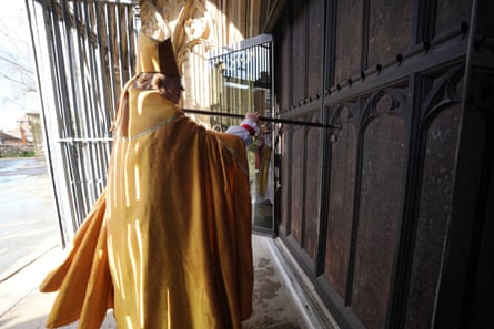 Archbishop of Canterbury Dame Sarah Mullally strikes the west door of Canterbury Cathedral