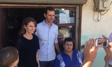 Syrian president Bashar al-Assad and his wife Asma visit an injured man from Tanunaah, Homs.