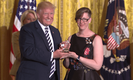 US teacher of the year stages silent protest as Trump awards prize – video