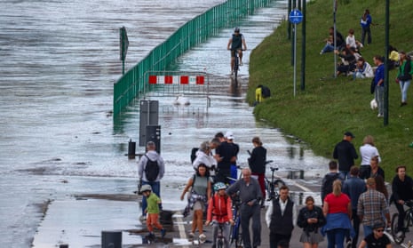 People gathered to watch the flood-wave peak after heavy rainfall raised the level of the Vistula River in Krakow, Poland on 15 September, 2024.