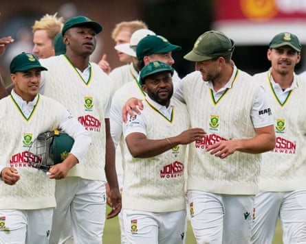 Temba Bavuma (centre) is embraced as his team enjoy victory in the second Test