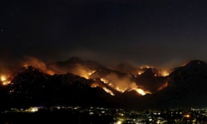 ‘At night you can see basically the outline of the fire on the mountain’: the Bighorn Fire burning in the wilderness of the Santa Catalina Mountains looms over homes as seen from Oro Valley, Arizona, last month.