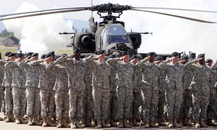 Troops saluting by helicopter