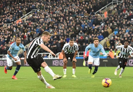 All eyes are on Newcastle United’s Matt Ritchie as he scores their second goal from the penalty spot.