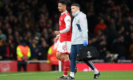 William Saliba limps off at the Emirates against Sporting on 16 March.