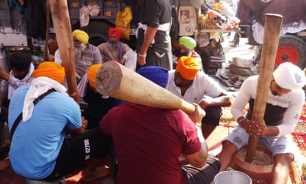 Protesters grind almonds to make an energy drink.